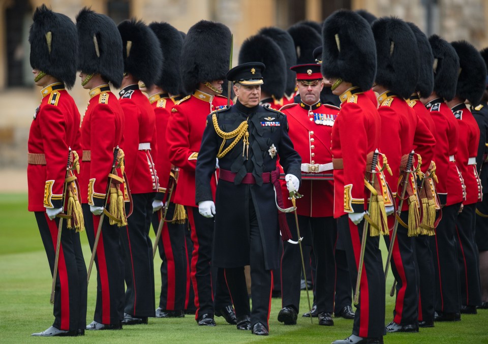 Prince Andrew makes an inspection during a parade by the Grenadier Guards at Windsor Castle on March 22, 2019 in Windsor