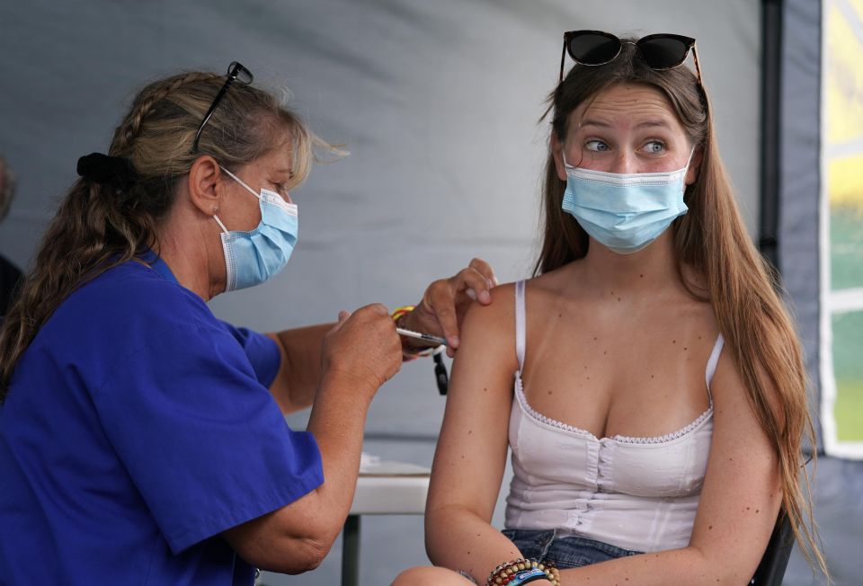 A 16-year-old gets a vaccine in Reading