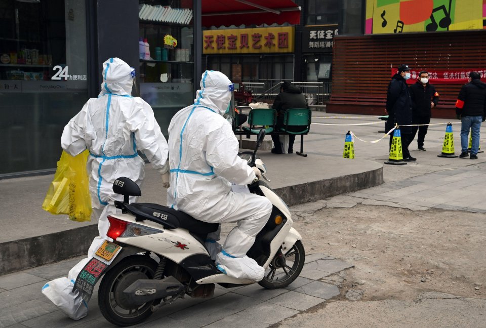 Medical workers race around the streets of Xian