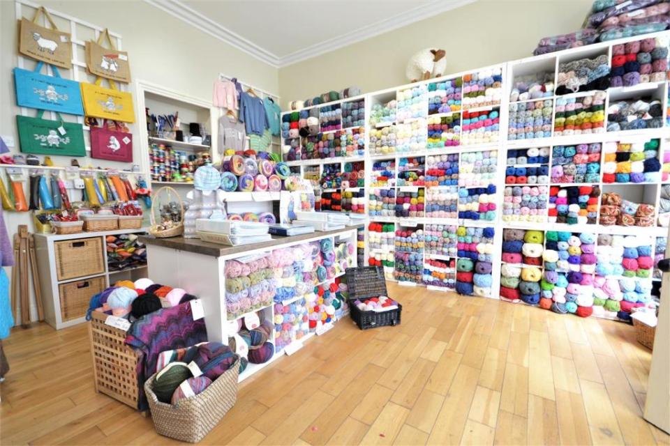 The commercial space is currently being used to sell brightly coloured wool