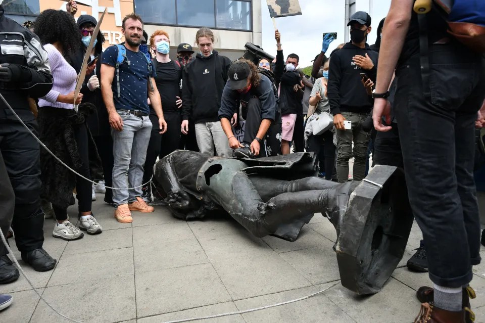 Protesters dragging the statue of Edward Colston to Bristol harbourside