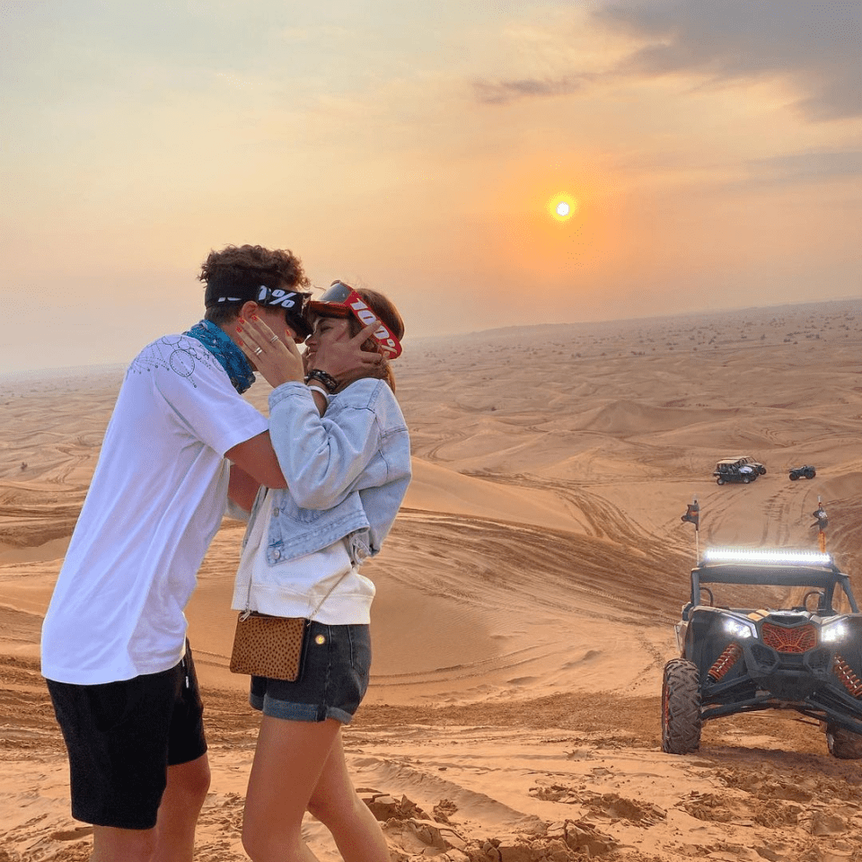 Lando shared a photo of them kissing during a New Year holiday to Dubai and captioned it: 'My sunshine'