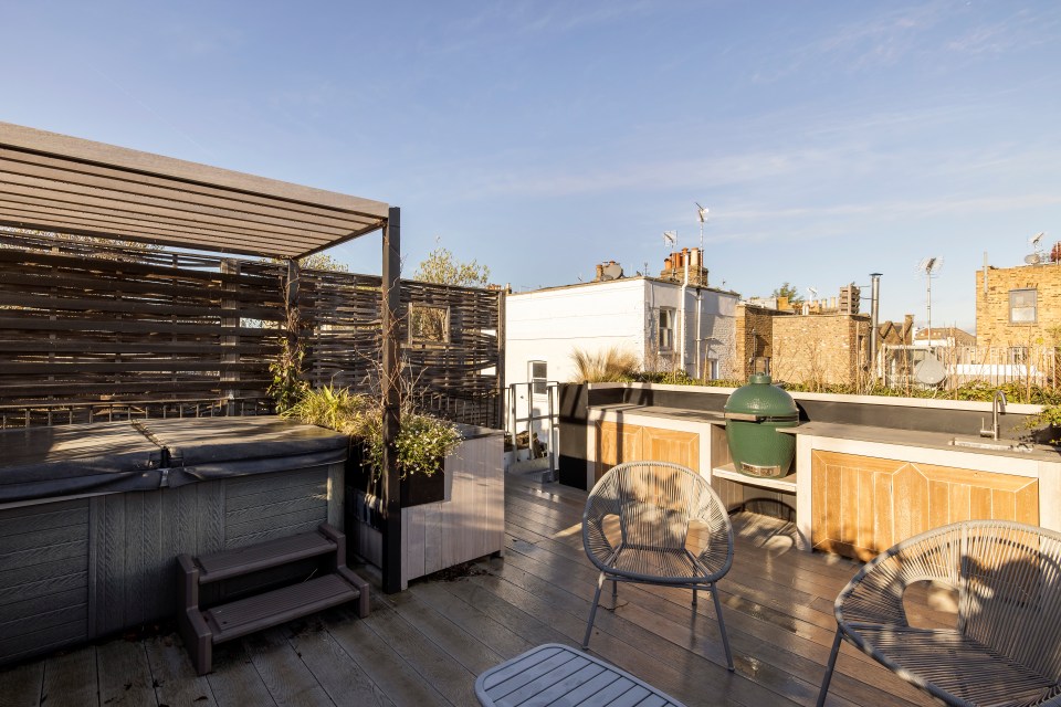 The lucky new homeowner will be able to dip in the hot tub on the roof terrace