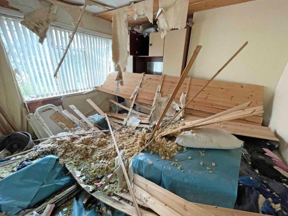 The ceiling has also collapsed and the house is covered in weeds