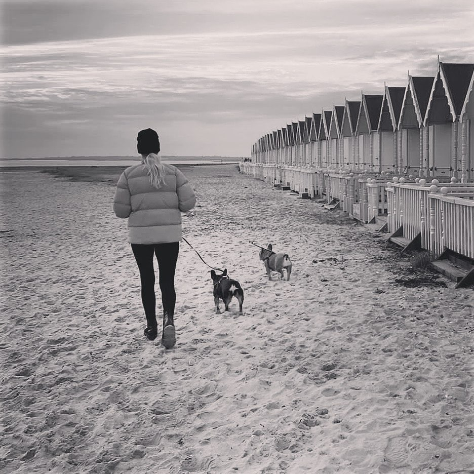 Denise posted a photo of her walking her two dogs alone