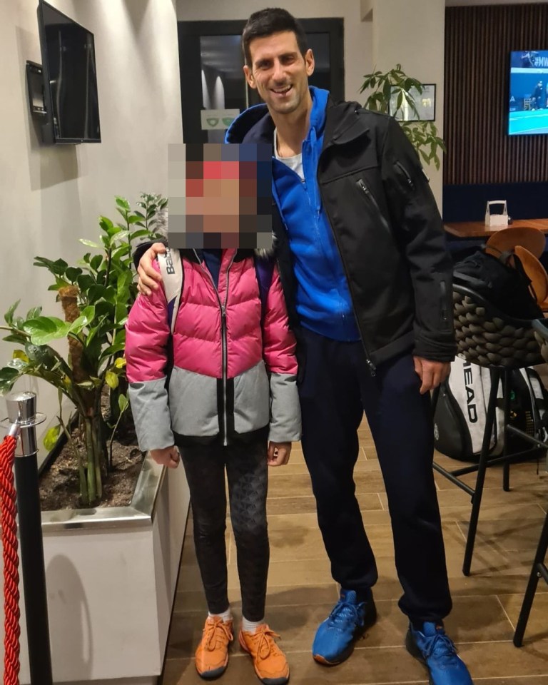 Djokovic posing with youngsters at an event with the Tennis Association of Belgrade on December 17