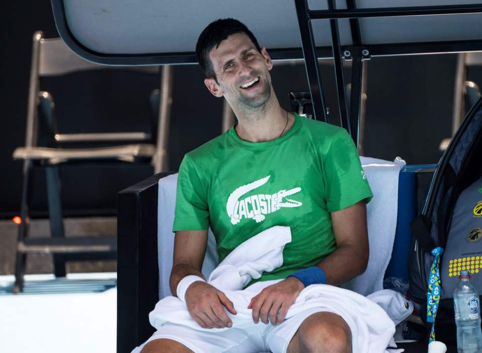 Novak Djokovic smiling as he practises for the Australian Open as he was named the tournament's top seed