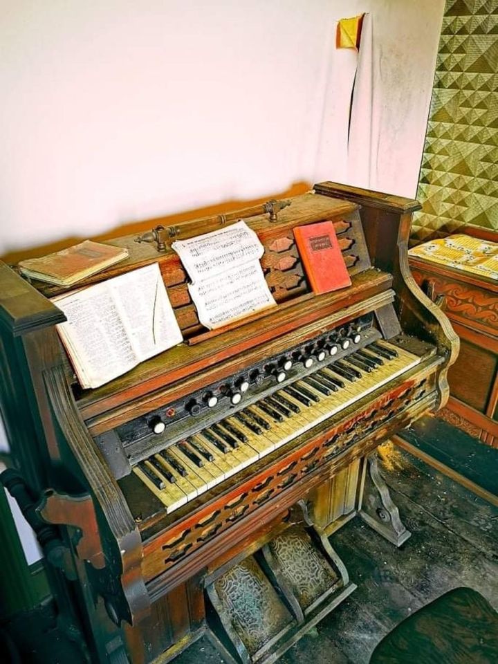 There were pianos with sheet music still laid out and decaying church books