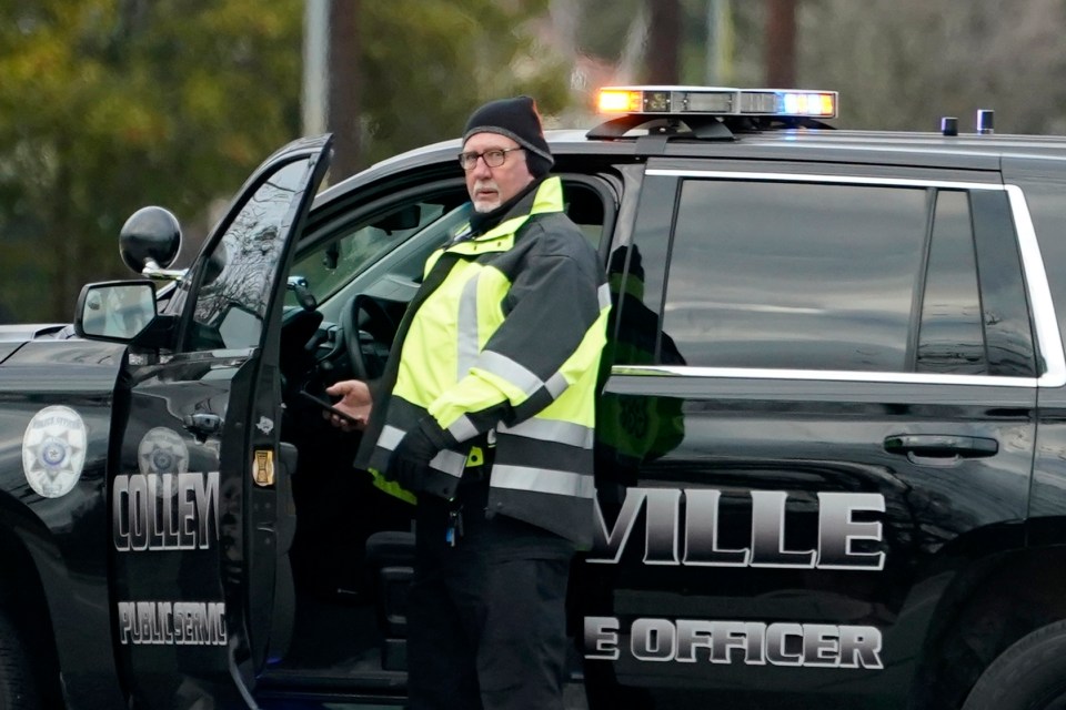 A law enforcement official patrols outside the Congregation Beth Israel synagogue in Colleyville, Texas where the siege took place