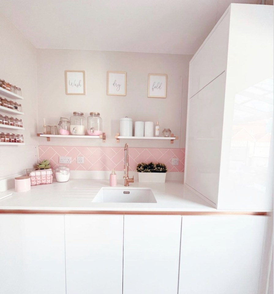 Now the kitchen is a pastel delight as pink splash back tiles and rose gold accessories lift the room