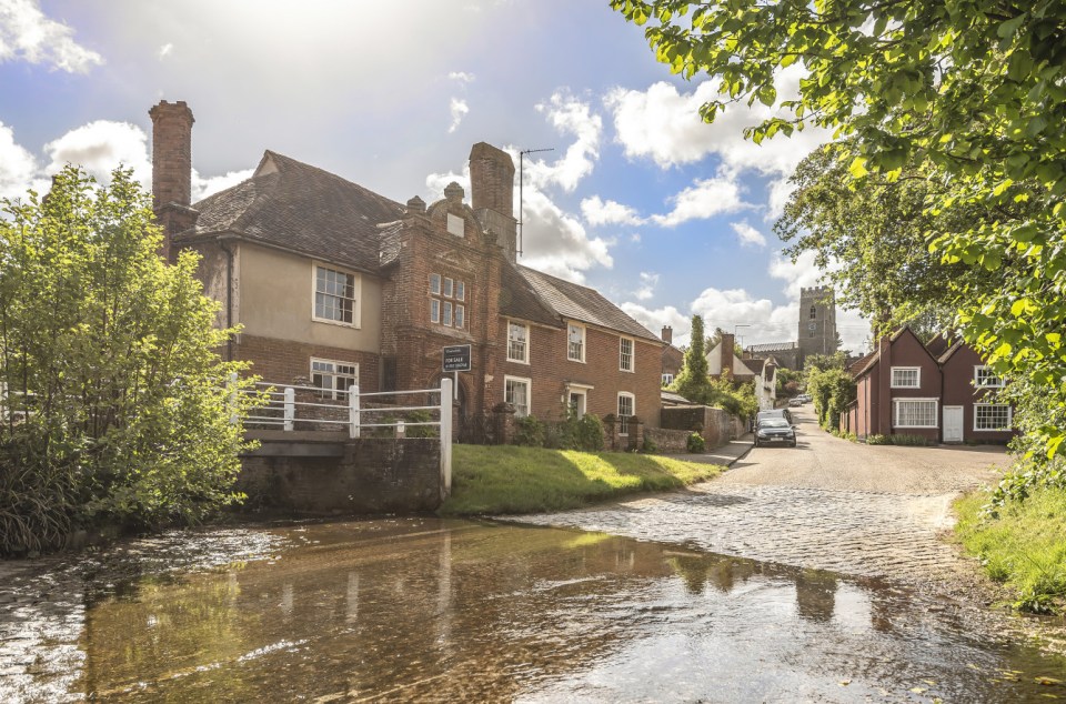 It has a further garden running alongside the stream with open fields behind