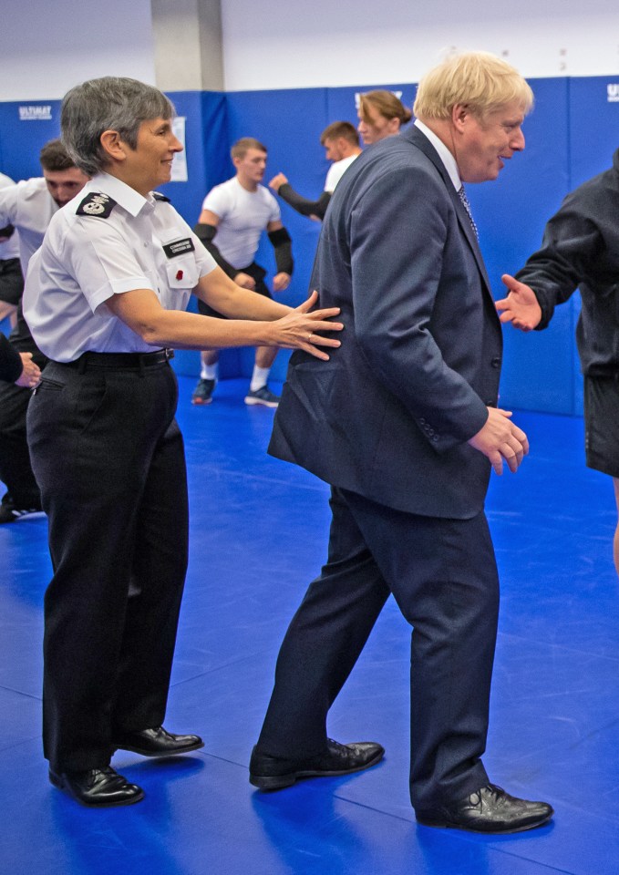 Dame Cressida and Boris Johnson at the Met’s training college in North London in 2019