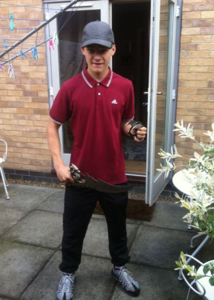 A thug who left his girlfriend unable to walk or talk after kidnapping her is seen posing with a hunting knife in unearthed pics