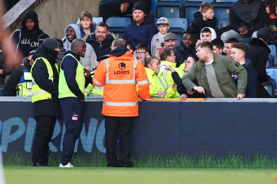 A furious Akinfenwa confronted a group of MK Dons fans