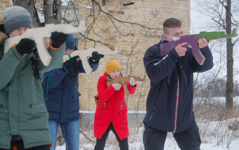 Ukrainians attend an open military training for civilians in Kiev