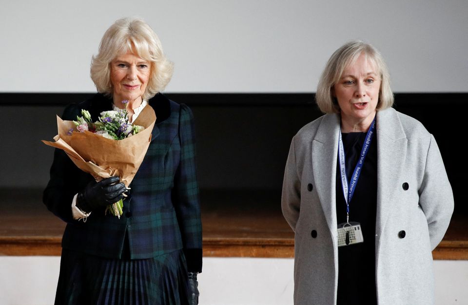 The Duchess of Cornwall unveiling a plaque during a school visit in Southdown, Bath today.