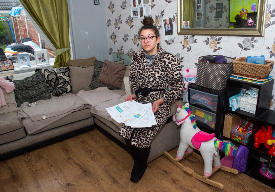 Single mum Symone McKitty-Smith kept her dressing gown on to keep warm