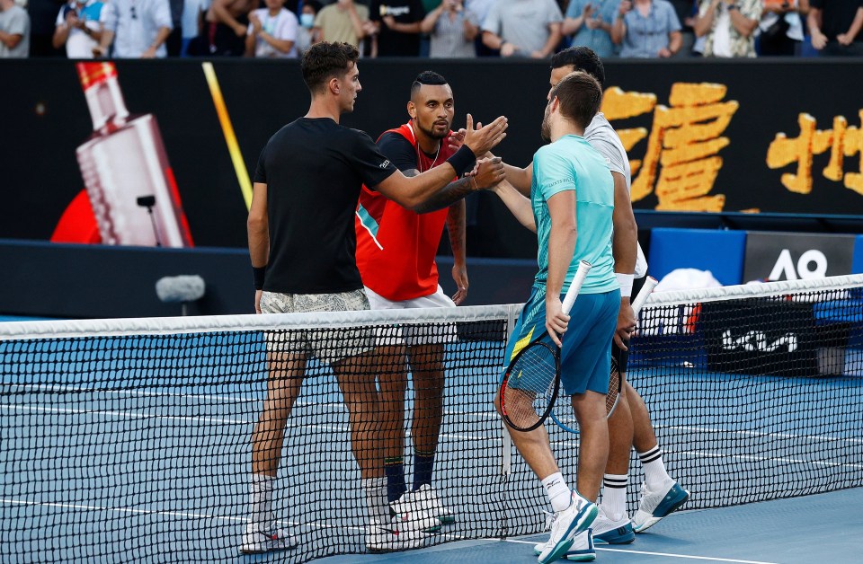 Nick Kyrgios and Thanasi Kokkinakis shake hands with Nikola Mektic and Mate Pavic at the end of the match