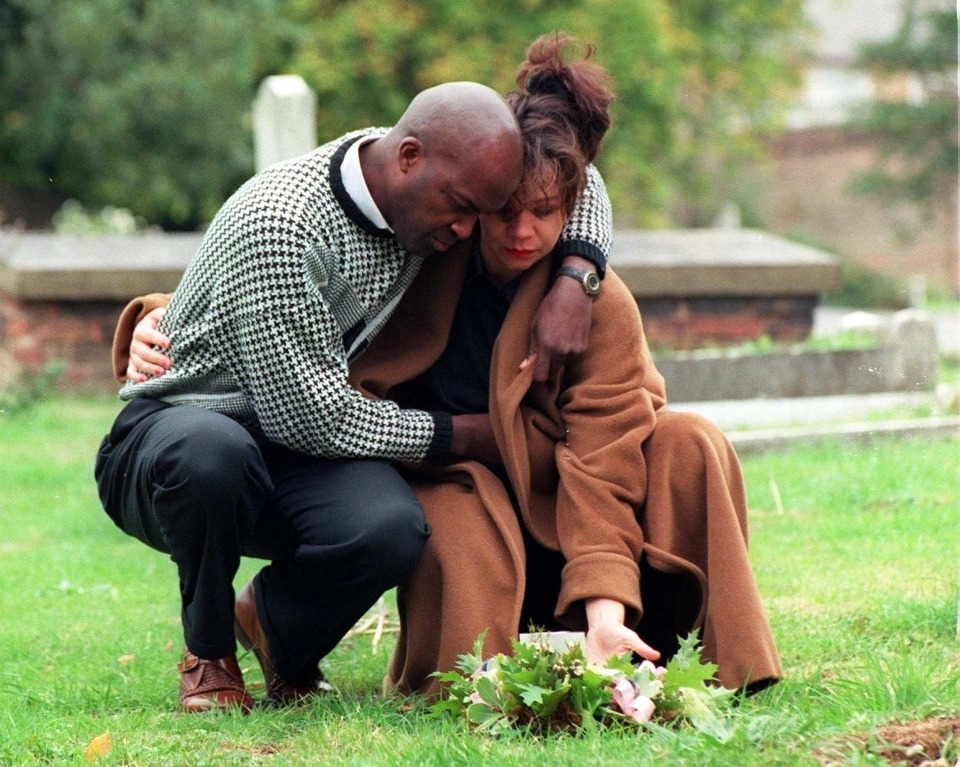 Mandy and her then partner Paul visit the grave on the first anniversary of the funeral