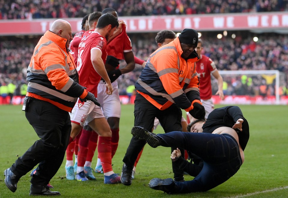 Toner was bundled to the ground by security