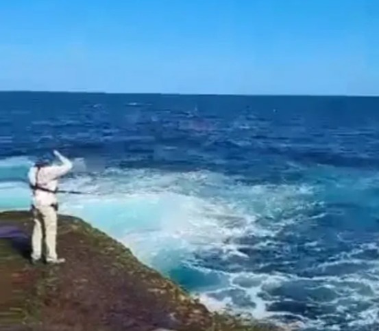 The horror unfolded in front of dozens of fishermen and beachgoers