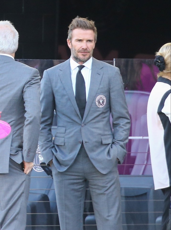 Becks rocked a grey suit complete with the Inter Miami badge