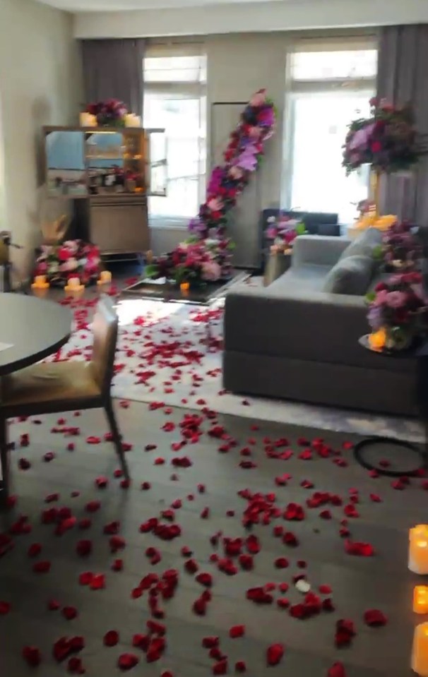 He decorated the apartment with rose petals