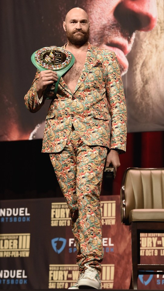 Fury models a Claudio Lugli bespoke suit during a press conference