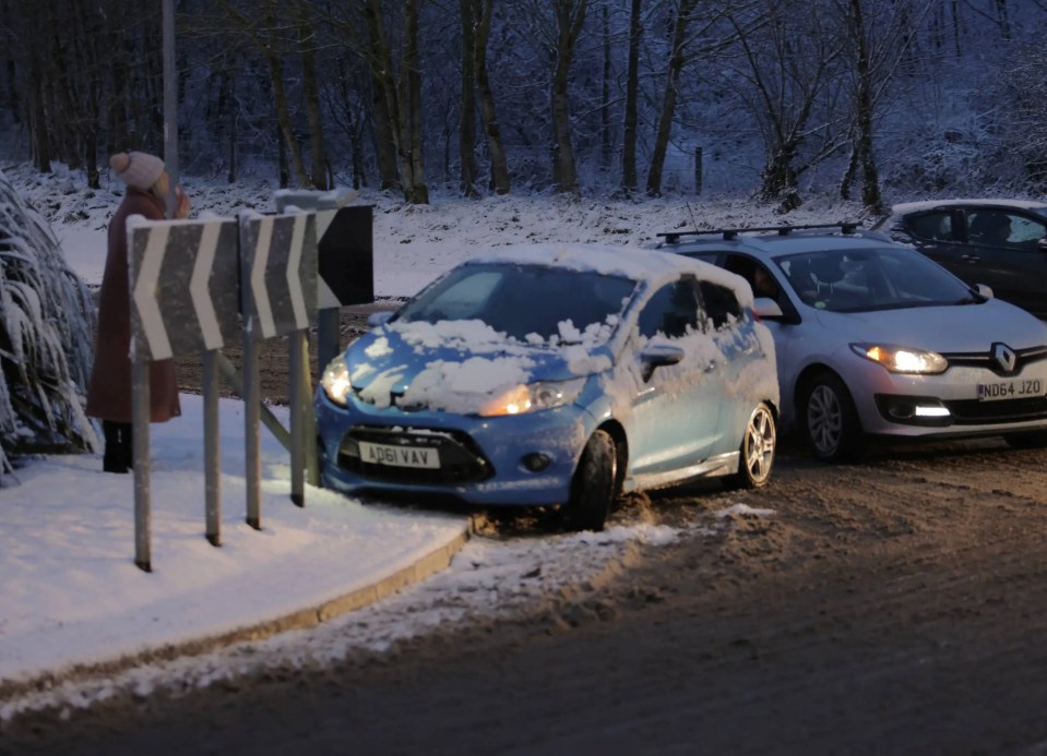 A motorist struggles to deal with the difficult driving conditions in Consett, County Durham this morning