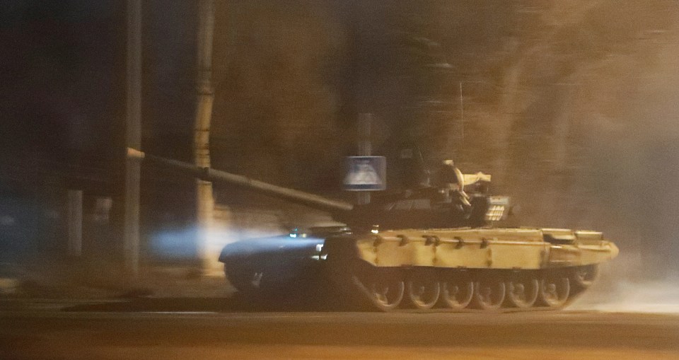 The Russian parliament gave Putin the green light to deploy troops abroad - a tank is pictured on the streets of Donetsk after Putin recognised two separatist regions of Ukraine as independent