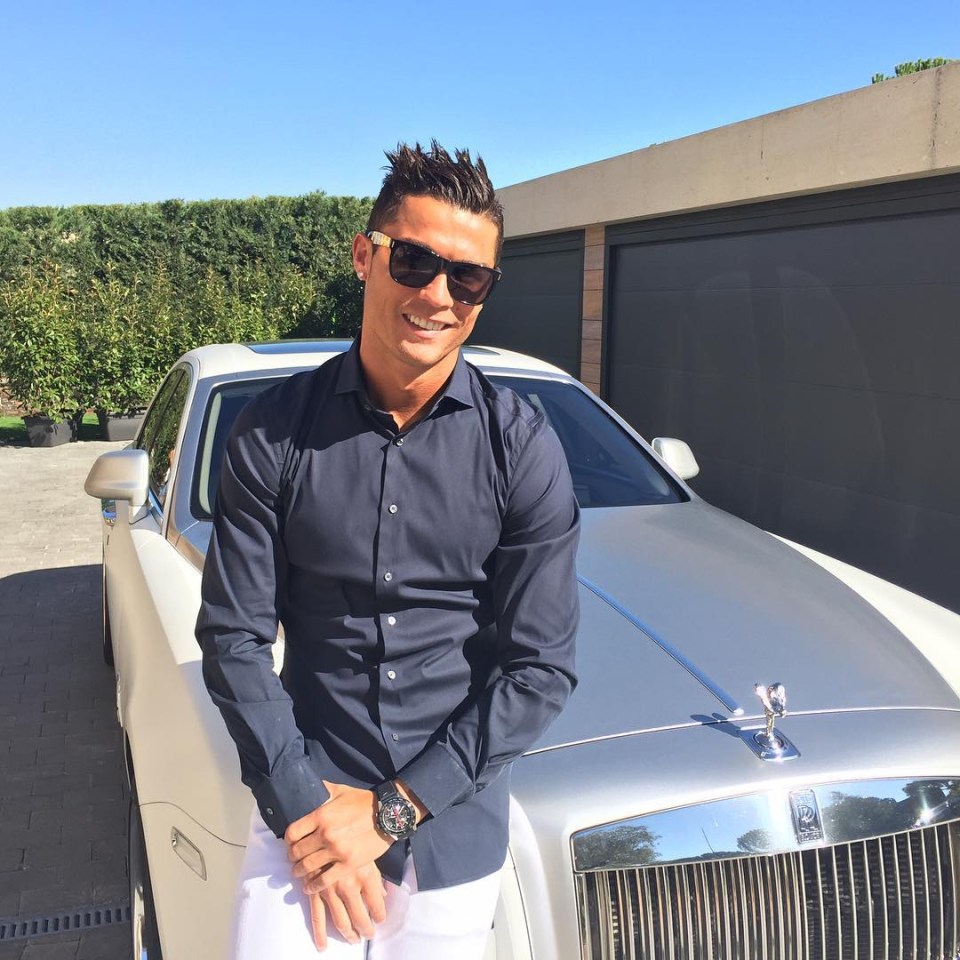 Ronaldo poses with one of his Rolls-Royces