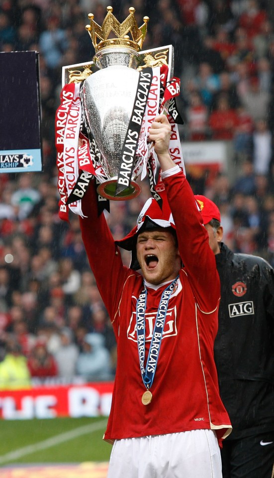 Rooney lifts the 2007 Premier League title.