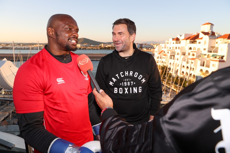 Dillian Whyte next to promoter Eddie Hearn