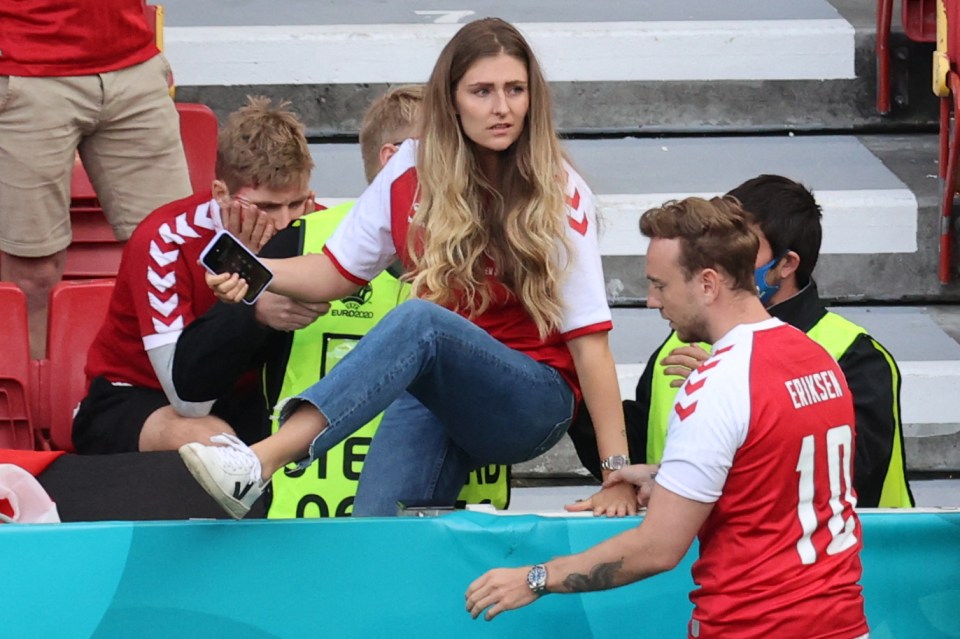 The distraught hairdresser leapt over the barriers to be at his side when he collapsed at  Copenhagen’s Parken Stadium