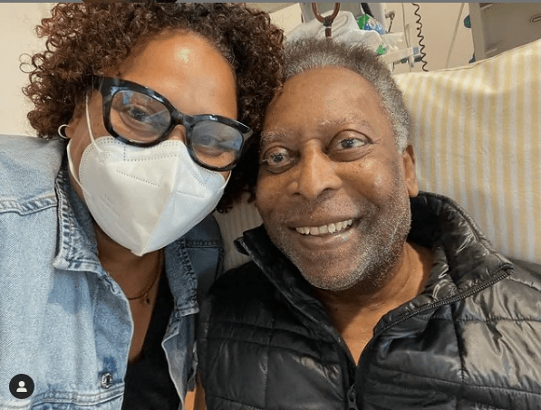 Pele alongside his daughter in hospital last year as he overcame a health scare