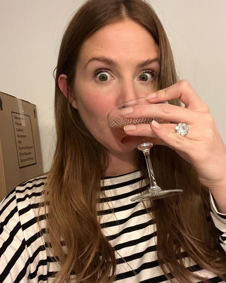 Millie celebrated theri move with a glass of wine