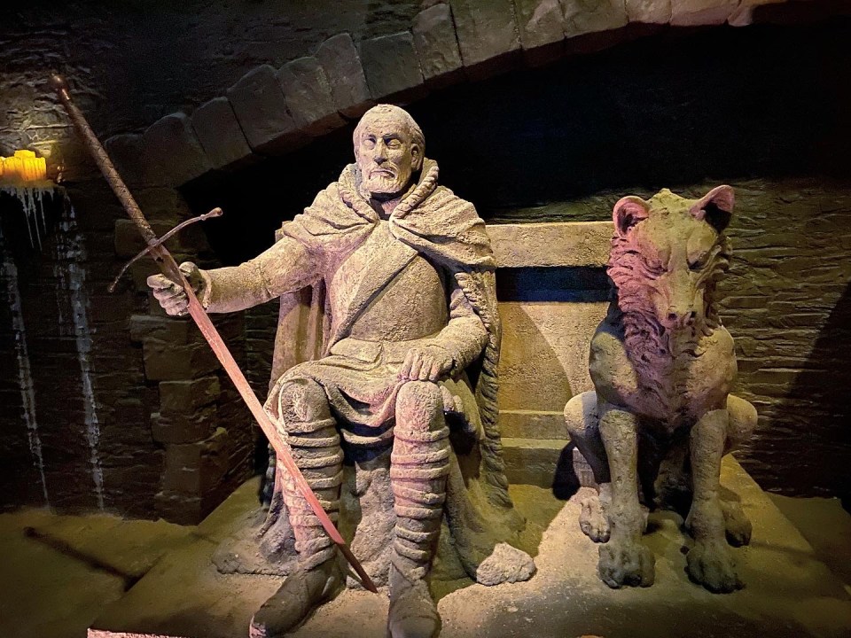 Inside the crypt room are stone statues of well known characters