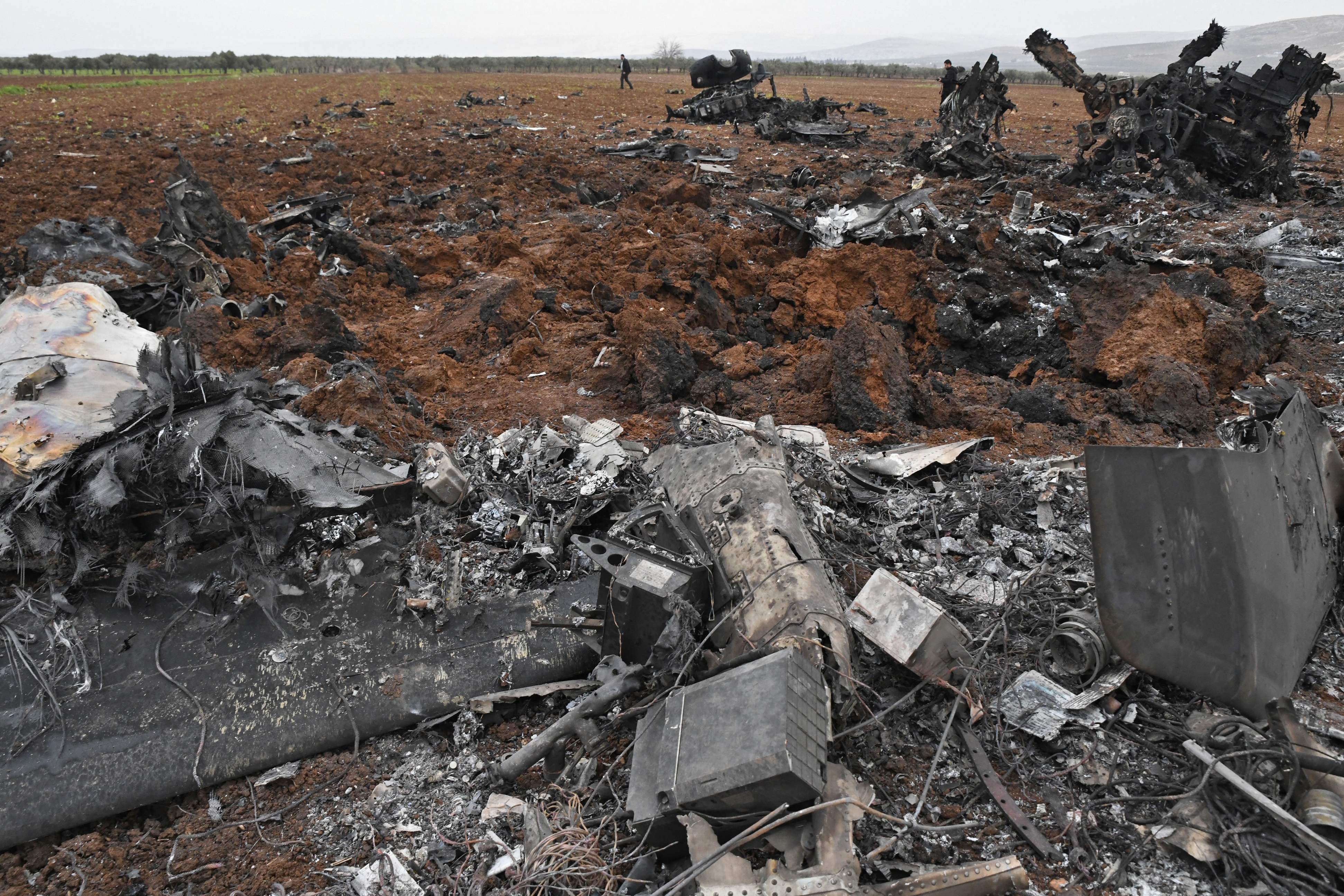 Wreckage of a US helicopter which was forced down in the raid on the house on al-Qurashi