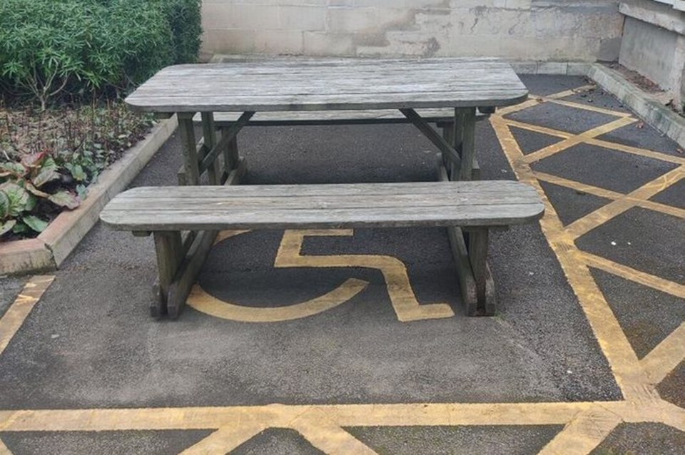 A school has been slammed for putting the bench in the disabled space