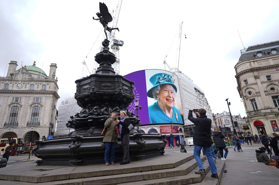 A new photo portrait of the Queen was unveiled on a huge TV screen at London’s Piccadilly Circus