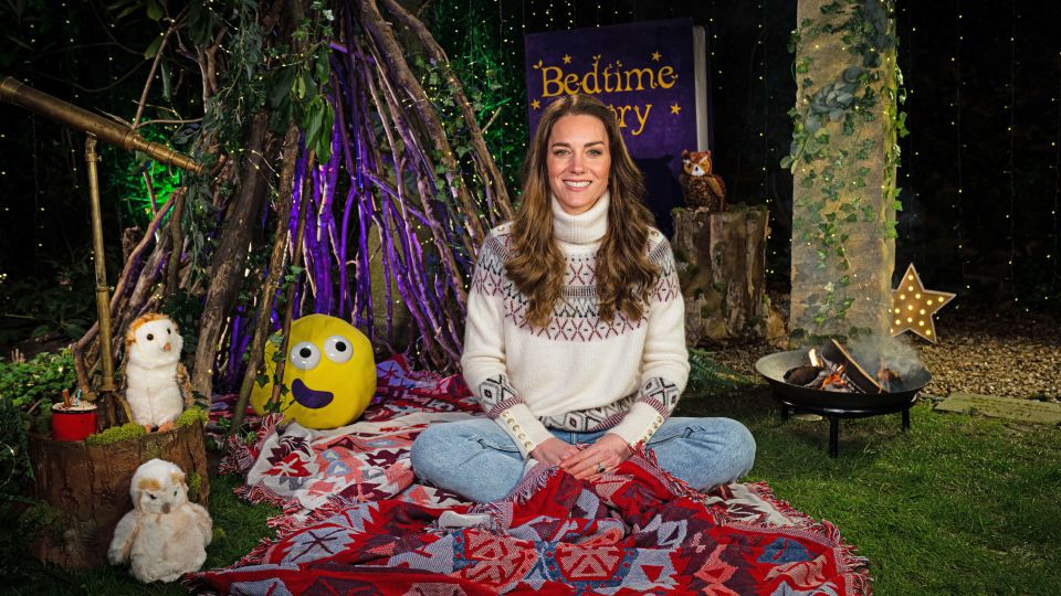 Kate wears a comfy roll-neck sweater, jeans and sits cross-legged during the programme