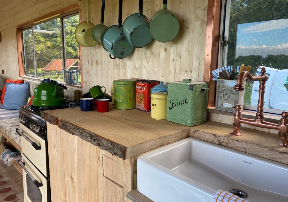 They used reclaimed wood for the countertops in the kitchen and bathroom