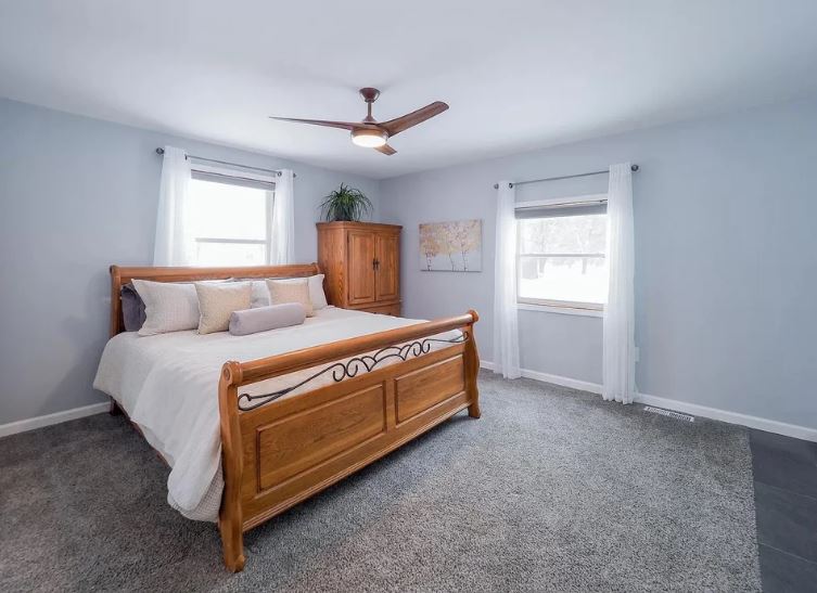 The first picture shows a plush and well-kept master bedroom