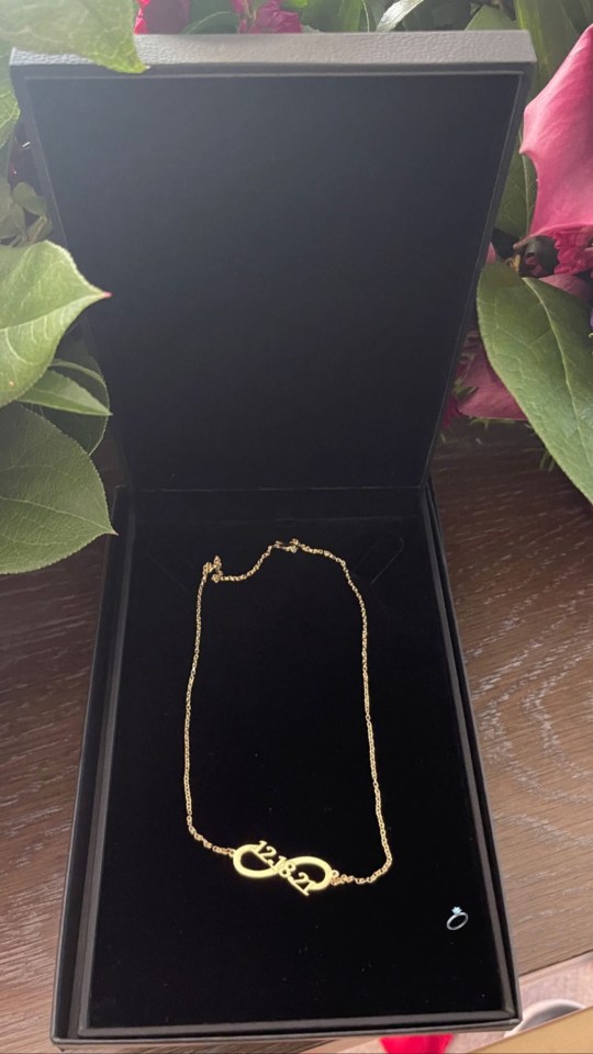 Ben bought her a gold necklace with their engagement date