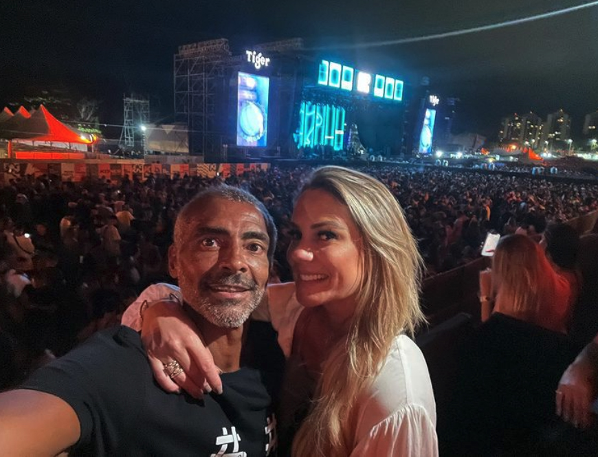 Romario posed with his new partner at a rap festival