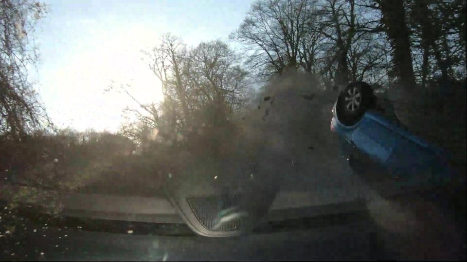 Dashcam footage shows the horrifying moment the blue Peugeot careered through the air