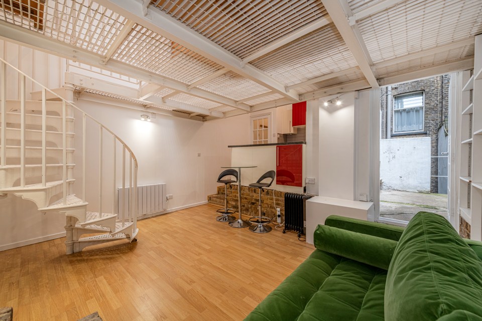 The open-plan entertainment space is comprised of an entrance hallway with bathroom and overhead storage