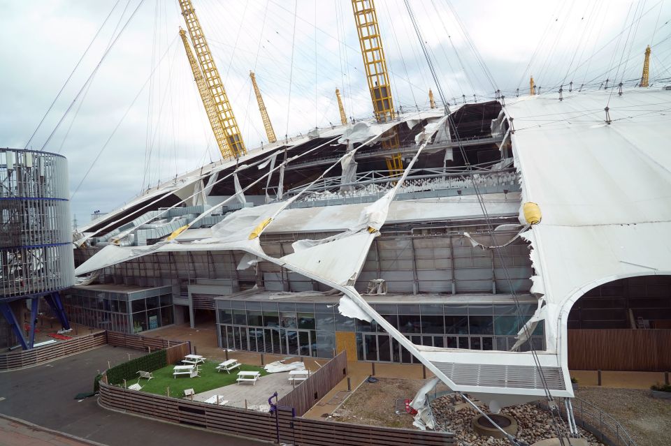 The roof of the O2 has been ripped off as the capital is ravaged by strong winds