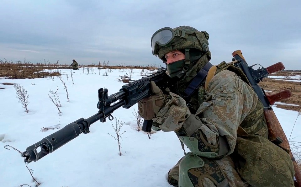 A Russian marine takes his position during drills in Belarus