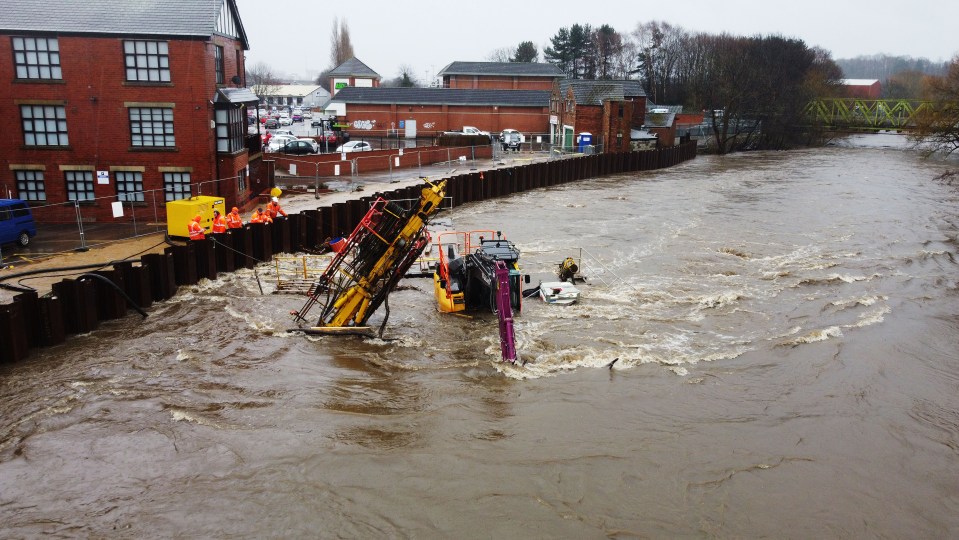 Machinery brought in to shore up flood defences in Leeds floated down the River Aire and sunk as a new storm moves in